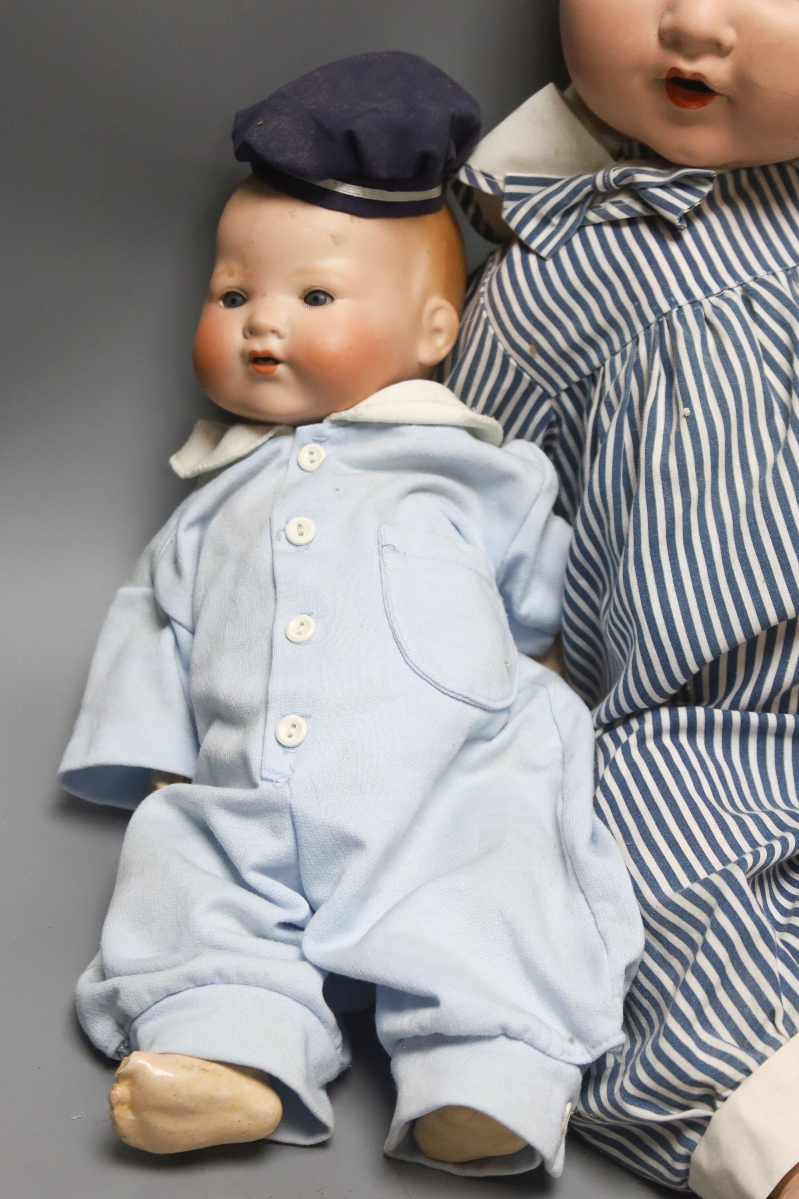 A bent limb AM H.14in. AM baby open mouth H.15in. AM baby painted bisque H23in.